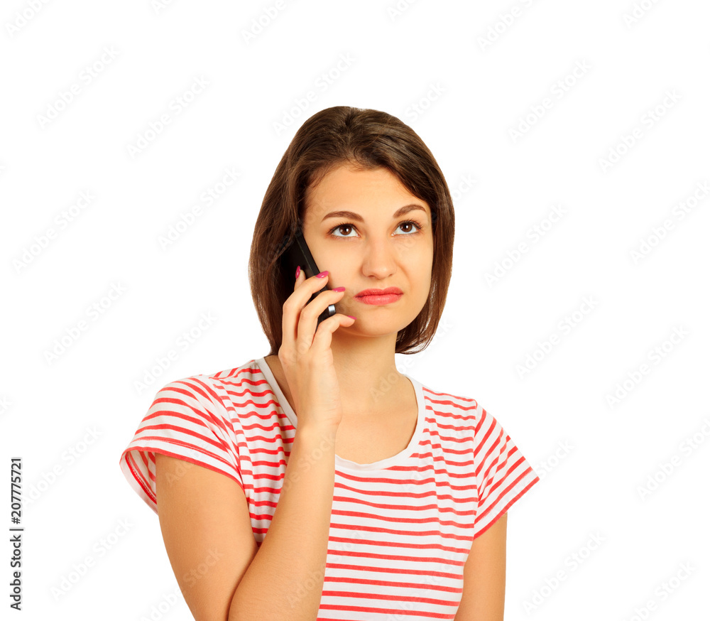 disgruntled girl talking on mobile phone. look with perplexity. emotional girl isolated on white background disgruntled girl talking on mobile phone. look with perplexity. emotional girl isolated on white background