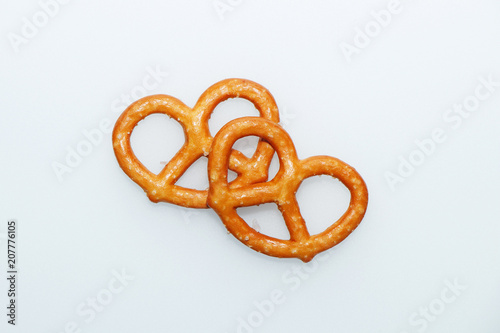 Salted delicious crispy pretzels on a white background