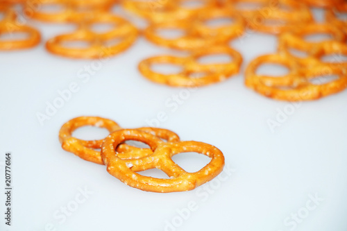 Salted delicious crispy pretzels on a white background