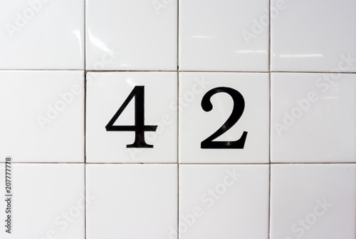 number 42 on ceramic wall tiles