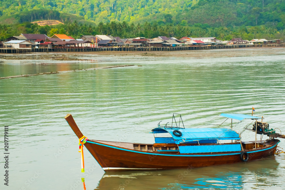 Obraz premium View to old wooden Old Town houses, long tail boat, Koh Lanta, Krabi, Thailand