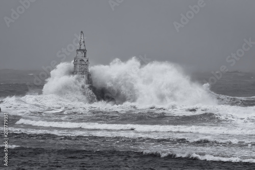  Big wave against old Lighthouse in the port of Ahtopol, Black Sea, Bulgaria on a stormy day.