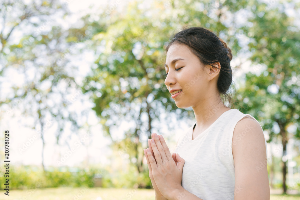 Young asian woman yoga outdoors keep calm and meditates while practicing yoga to explore the inner peace. Yoga and meditation have good benefits for health. Yoga Sport and Healthy lifestyle concept. Young asian woman yoga outdoors keep calm and meditates while practicing yoga to explore the inner peace. Yoga and meditation have good benefits for health. Yoga Sport and Healthy lifestyle concept.