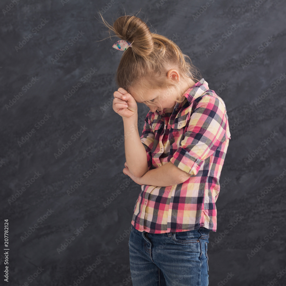 Thoughtful little girl on gray background Thoughtful little girl on gray background