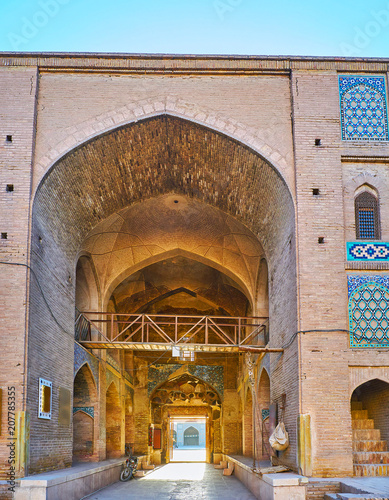 The portal between Ganjali Khan Caravanserai and square, Kerman, Iran photo