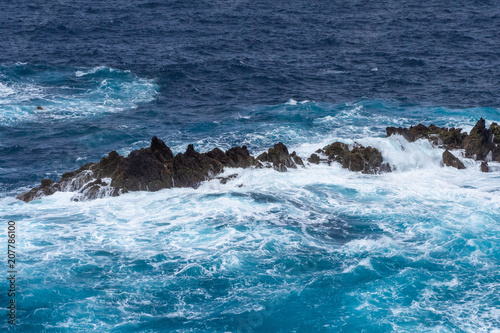 Waves crashing against a rocky coast in Atlantic ocean