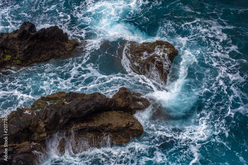 Waves crashing against a rocky coast in Atlantic ocean