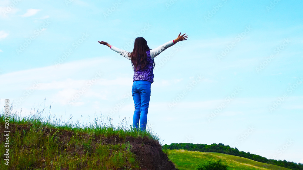 Girl walking in the meadow.Picturesque landscape. Girl walking in the meadow.Picturesque landscape.