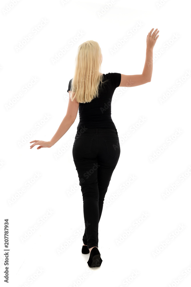 full length portrait of blonde girl wearing black clothing, isolated on white background. full length portrait of blonde girl wearing black clothing, isolated on white background.