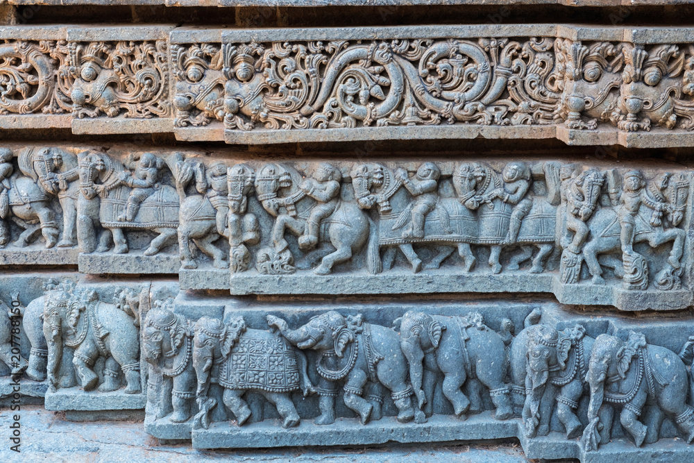 Carvings on the lower outer wall of the 13th century Channakeshava temple at Somnathpur in Karnataka. It is built of soapstone which is initially soft for carving and hardens over time