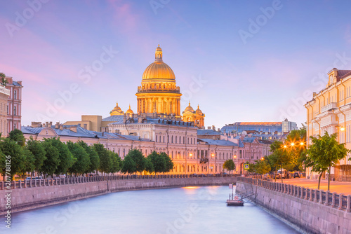 Canvas Print Saint Isaac Cathedral across Moyka river in St. Petersburg