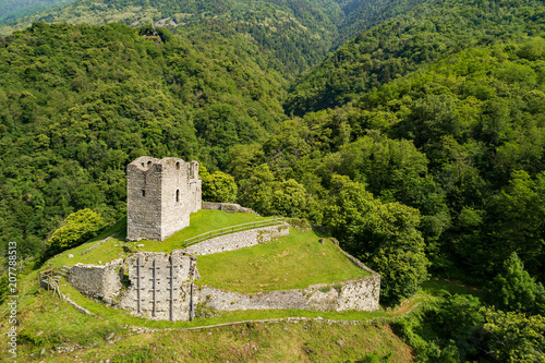 Valtellina (IT) - Costiera dei Cech - Castello di Domofole (1100) - Vista aerea photo