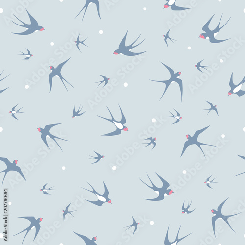 Seamless pattern with flying swallows