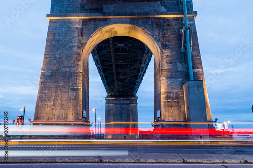 Long exposure of passing traffic under Jacques Cartier Bridge in Montreal