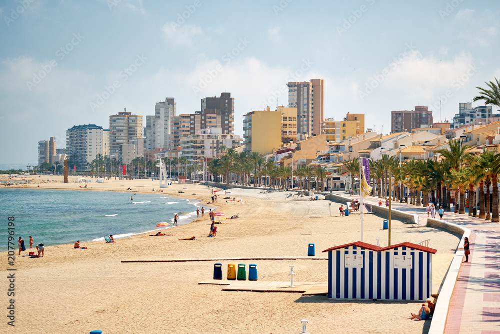 Sandy beach and cityscape El Campello. Alicante, Spain