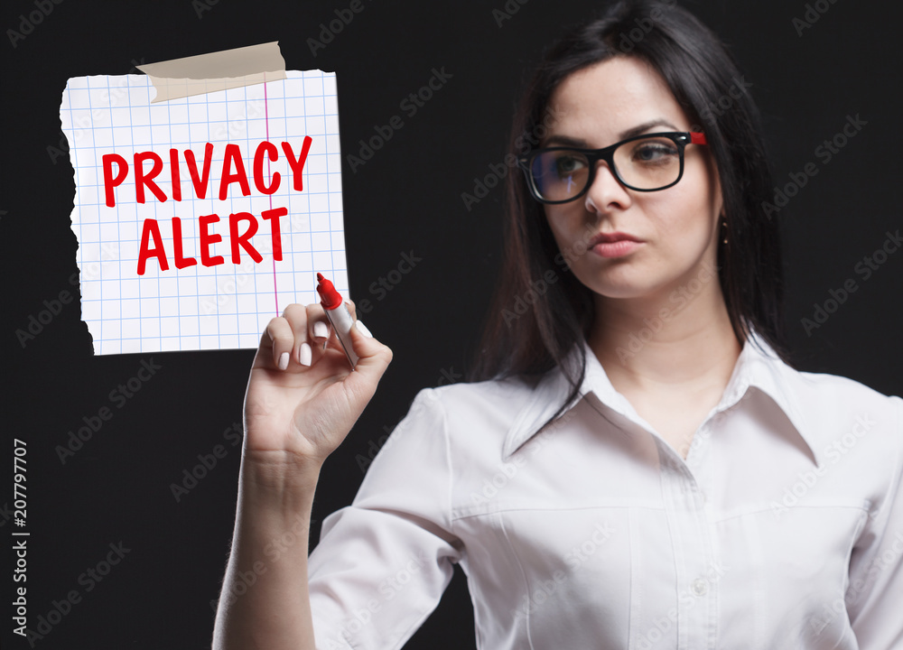 The concept of marketing, technology, the Internet and the network. A young businessman shows what is important for business: Privacy alert The concept of marketing, technology, the Internet and the network. A young businessman shows what is important for business: Privacy alert