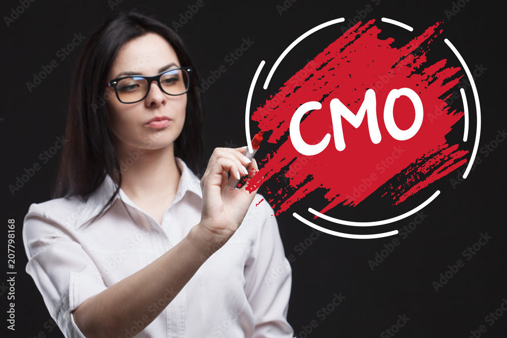 The concept of marketing, technology, the Internet and the network. A young businessman shows what is important for business: CMO The concept of marketing, technology, the Internet and the network. A young businessman shows what is important for business: CMO