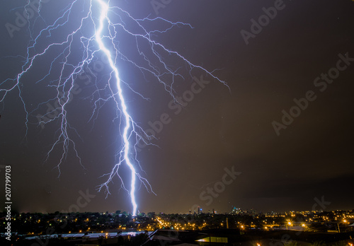 Lightning Bolt striking city skyline