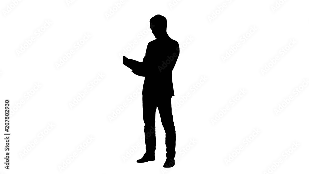 Silhouette Young student reading a law book Silhouette Young student reading a law book