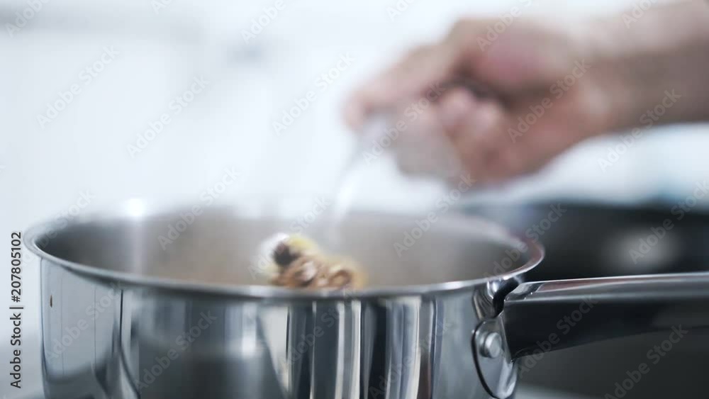 Close up of an unrecognizable chef s hand boiling an octopus in a Chinese restaurant. Locked down real time medium shot Close up of an unrecognizable chef s hand boiling an octopus in a Chinese restaurant. Locked down real time medium shot