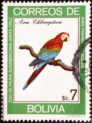 Green-winged macaw on bolivian postage stamp