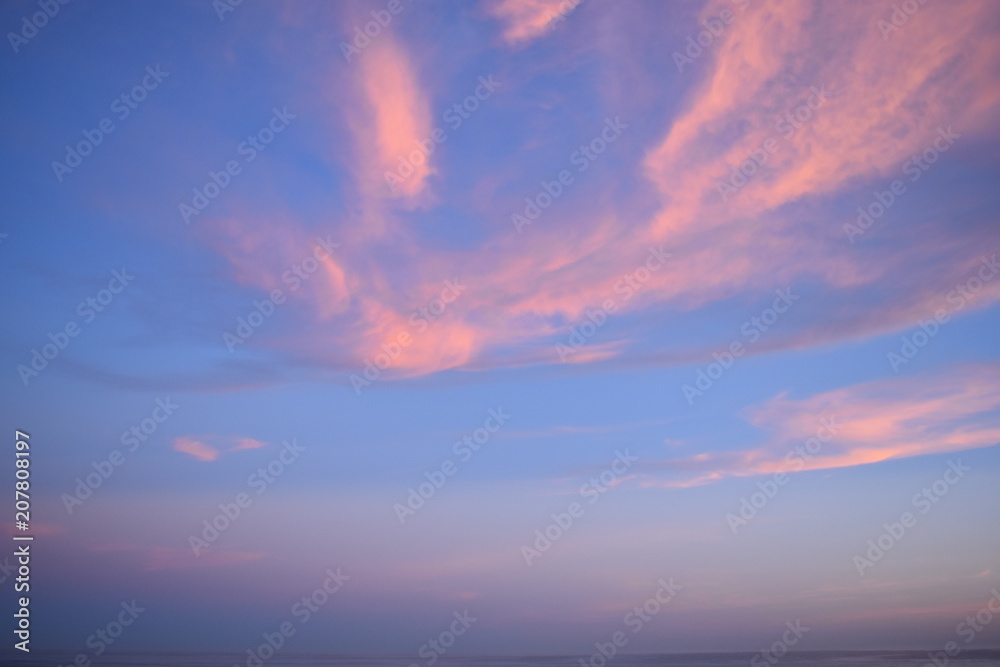 Colorful sky at sunset with red colored clouds 