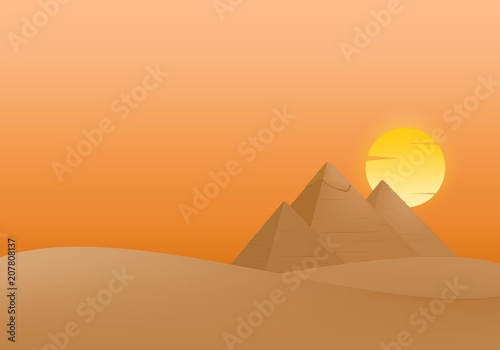 Summer Landscape with sunset and the Egyptian Pyramids of Giza in the Sand with yellow and orange cloud sun in the orange sky. 