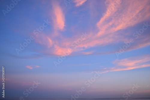 Colorful sky at sunset with red colored clouds 