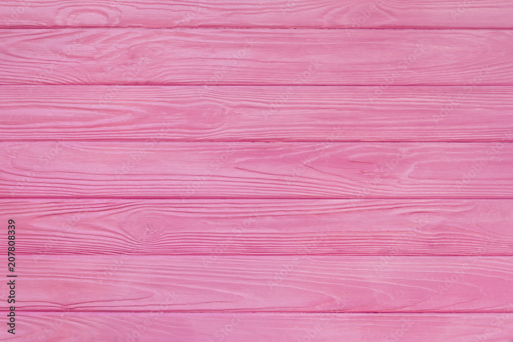 Brushed wood texture with pink color background Brushed wood texture with pink color background