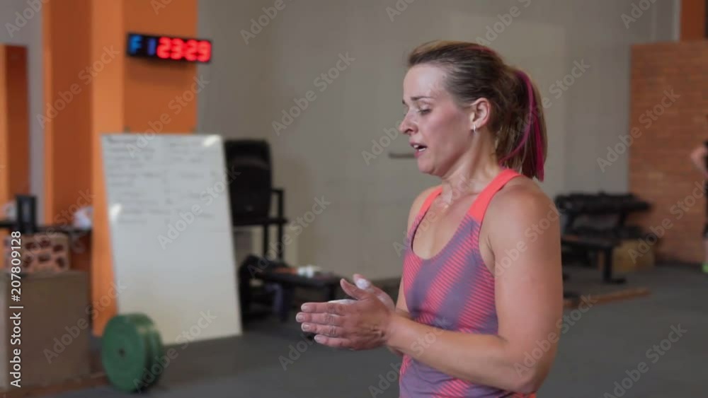 Tired fitness woman walking in gym Tired fitness woman walking in gym