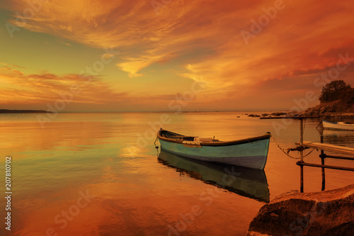 fishing boats on the sea beach during sunset © petiast
