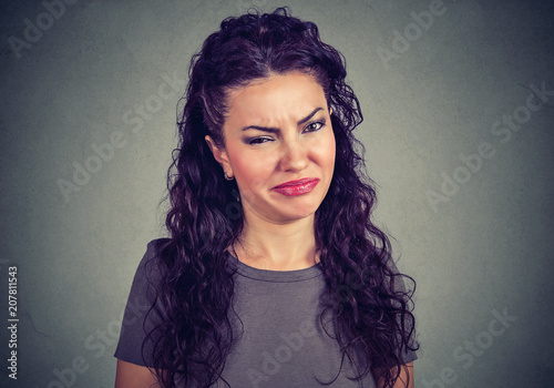 Young girl looking with mistrust