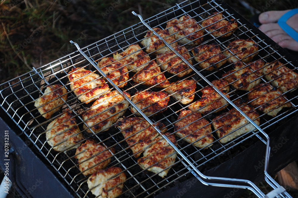 Chicken meat is grilled on the nature.
Chicken meat is grilled on the nature.