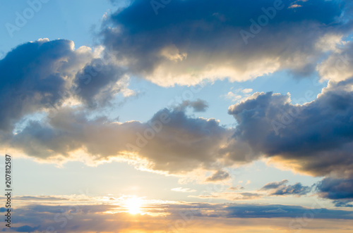 Fototapeta Naklejka Na Ścianę i Meble -  Storm clouds against a bright blue sky,sunset.