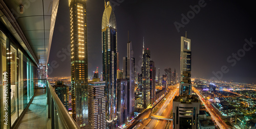 Photography Dubai skyline during night with amazing city center lights and Sheikh Zayed road traffic,United Arab Emirates