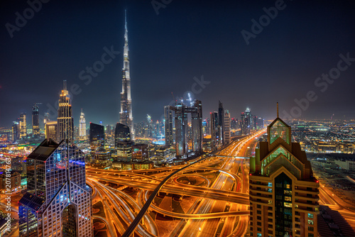 Dubai skyline during night with amazing city center lights and Sheikh Zayed road traffic,United Arab Emirates.