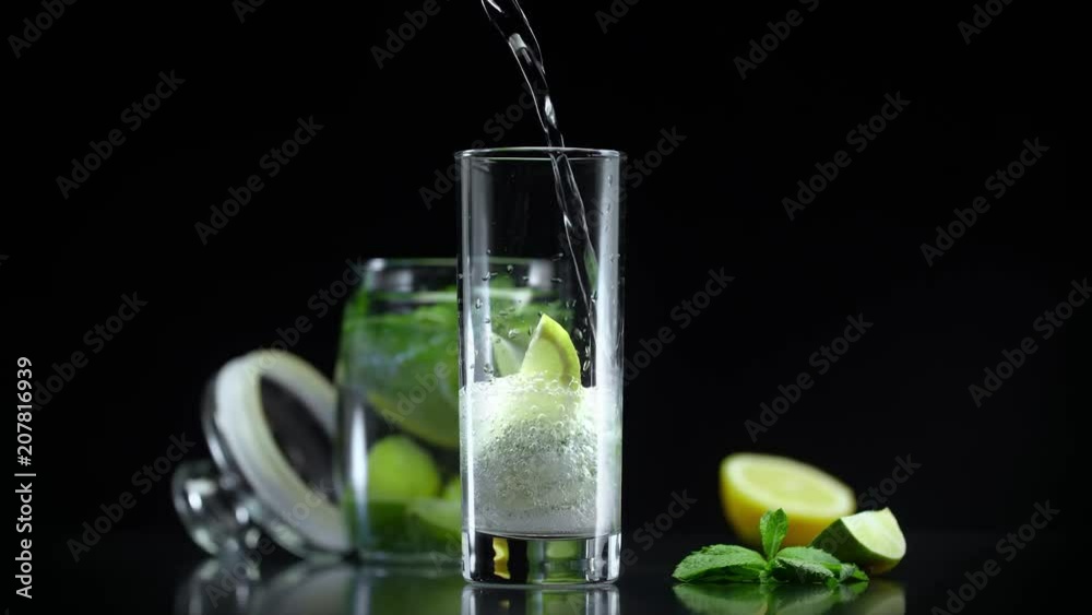 Lemonade with lime lemon and mint in cold sparkling soda water. Refreshing citrus non alcoholic mojito cocktail prepared for hot summer party
