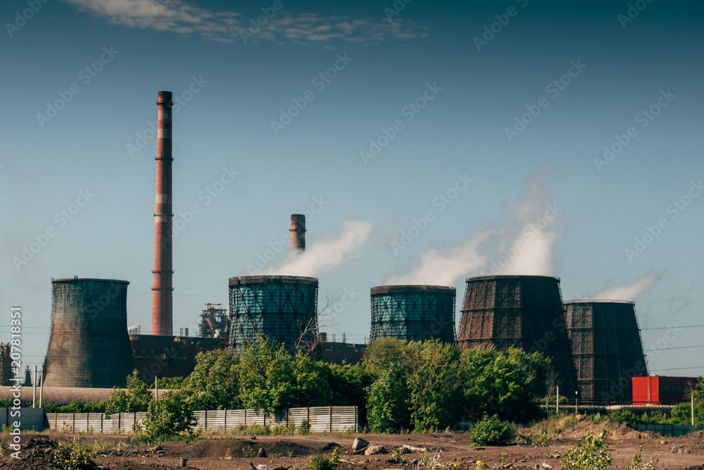 Panorama of smokestacks and pipes of metallurgical plant, smoke pollution
