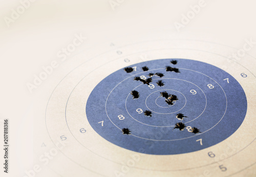 Target with real bullet hole, Focused on the center of the target, Selective focus