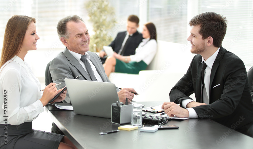 client talking with the staff at the Desk in the office client talking with the staff at the Desk in the office