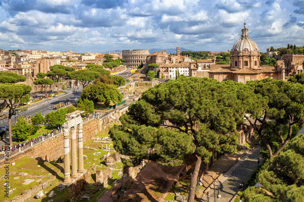 Fototapeta premium Aerial scenic view of Colosseum, Roman Forum and church of Santi Luca e Martinain in Rome, Italy. Rome architecture and landmark.rchitecture and landmark.