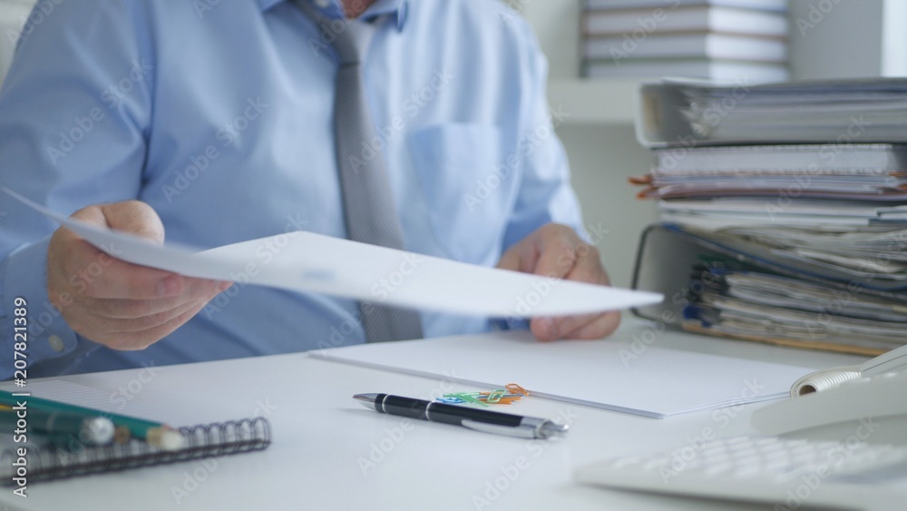 Businessman Working With Financial Documents In Accounting Office Businessman Working With Financial Documents In Accounting Office