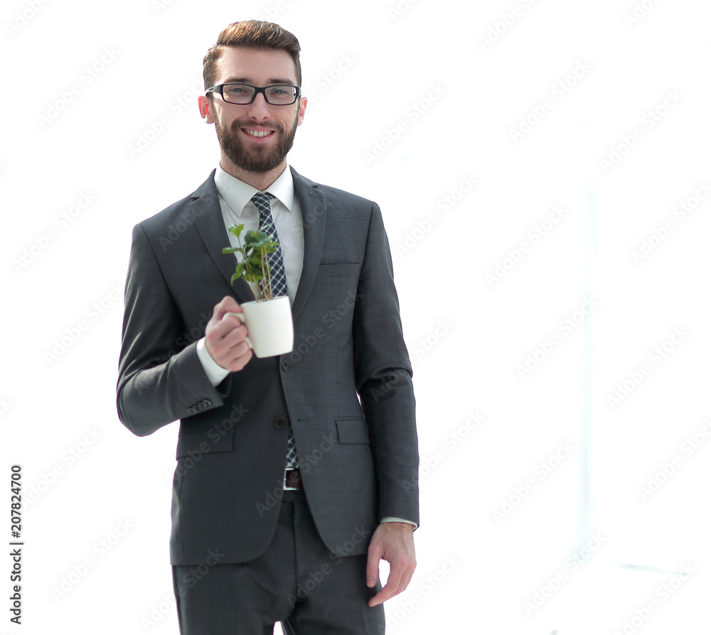 businessman is holding a green young plant businessman is holding a green young plant