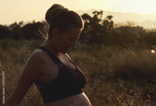 Attractive pregnant woman outdoors