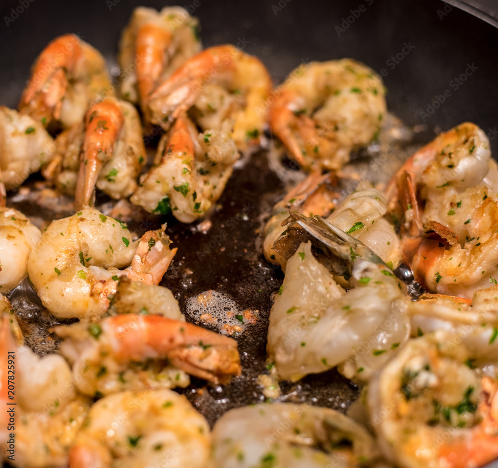 Jumbo Shrimp Scampi Sauteeing in Butter and Olive Oil Jumbo Shrimp Scampi Sauteeing in Butter and Olive Oil