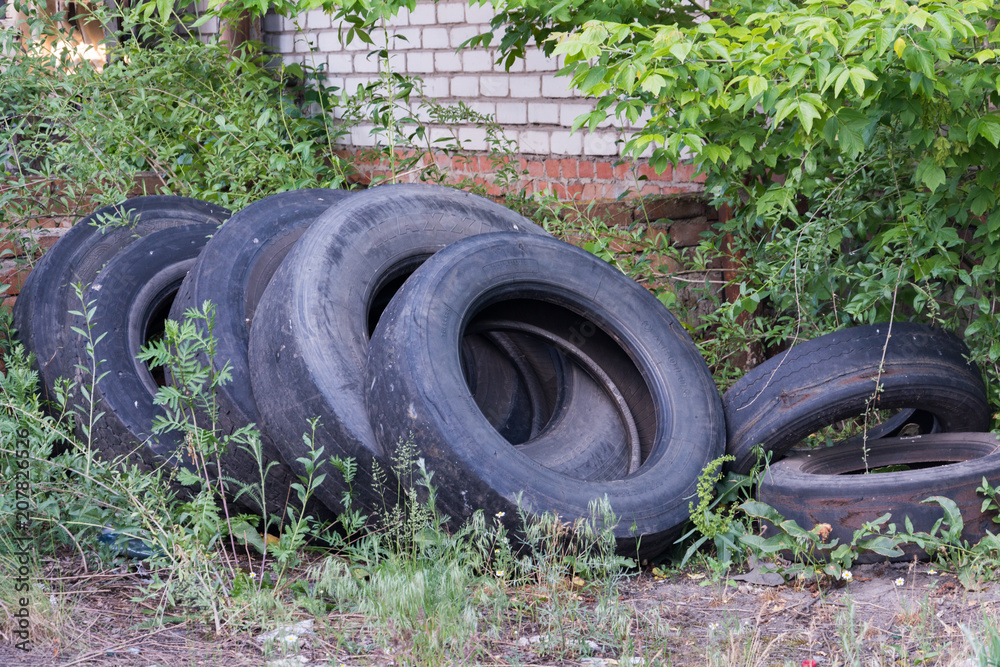 old worn tires are a big pile in a landfill
