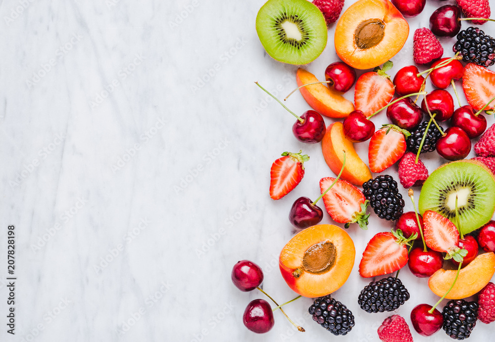 Fruits and berries copy space on marble table top view flat lay. Fruits and berries copy space on marble table top view flat lay.
