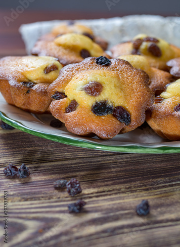 Traditional homemade French butter muffins stars with raisins, tasty dessert photo