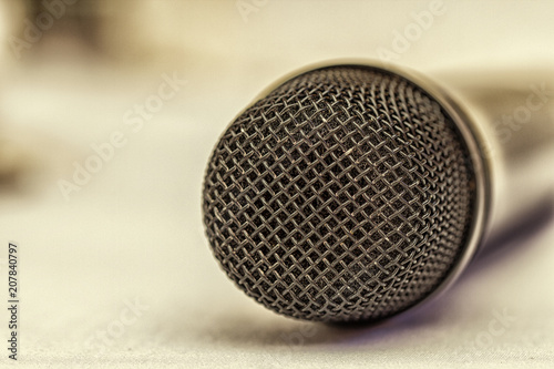 Microphone, selective focus, on a light background, close up © maykal