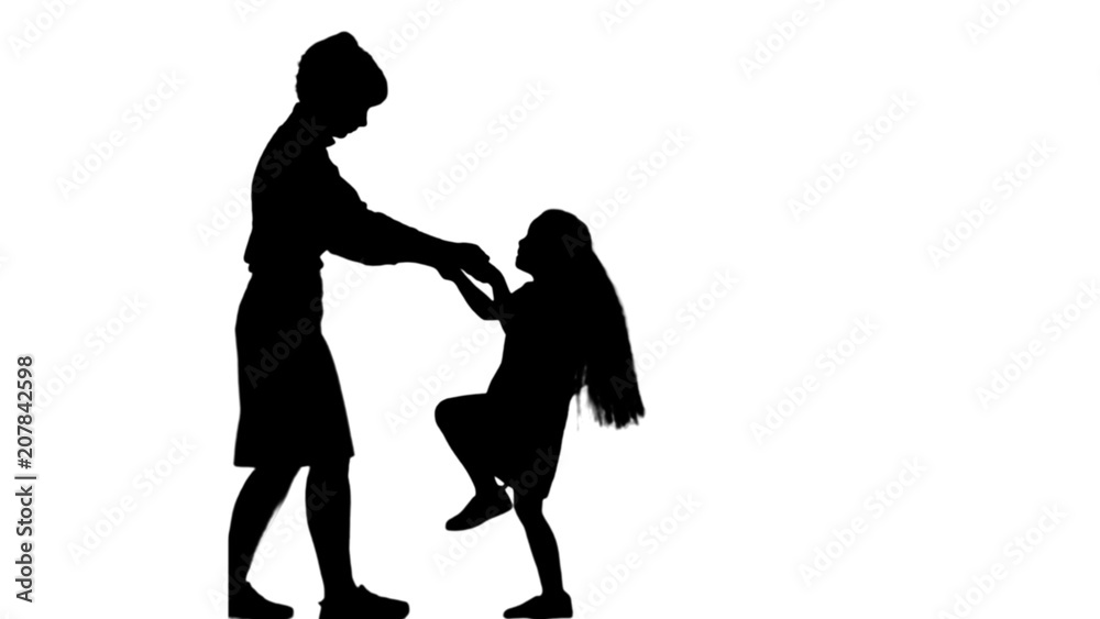 Silhouette Mother and daughter dancing together track matte